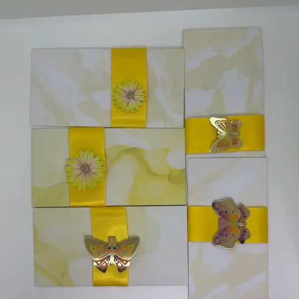Yellow butterfly and daisy money envelopes