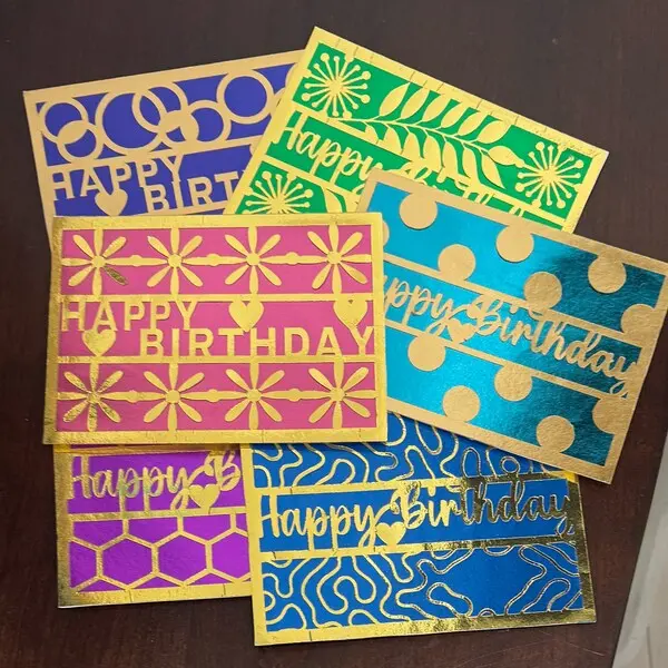 Gold foil happy birthday cards in assorted colors