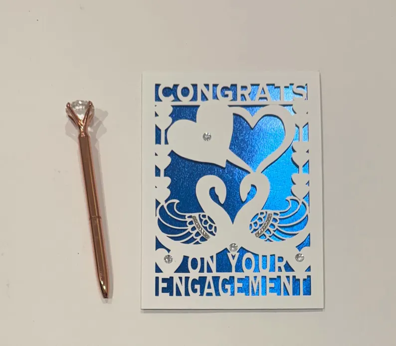Paper-cut swan engagement card